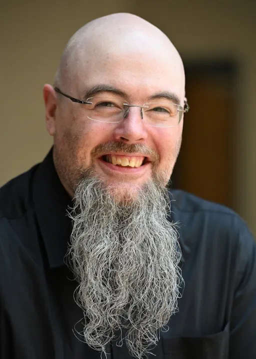 Picture of Wesley Dean wearing a black dress shirt